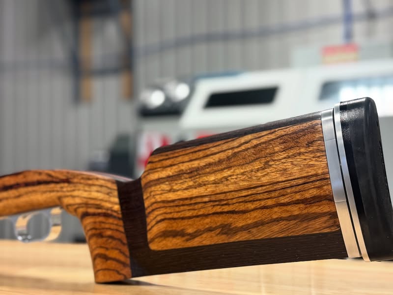 Zebra wood custom rifle stock with contrasting hardwood